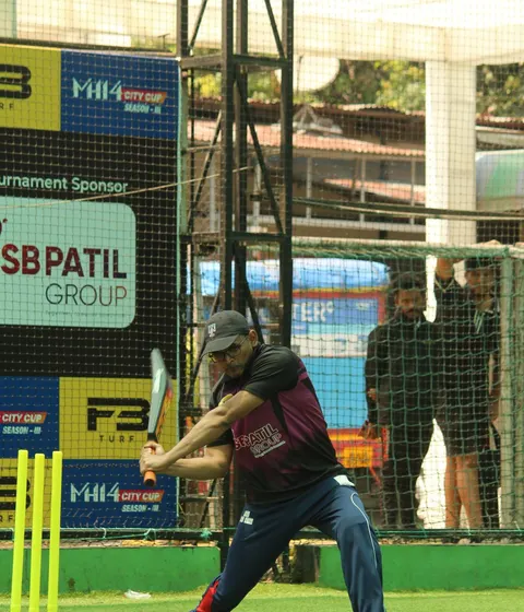 A batter playing turf cricket in Pimpri-Chinchwad